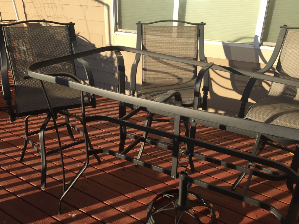 Patio table with broken glass top - before