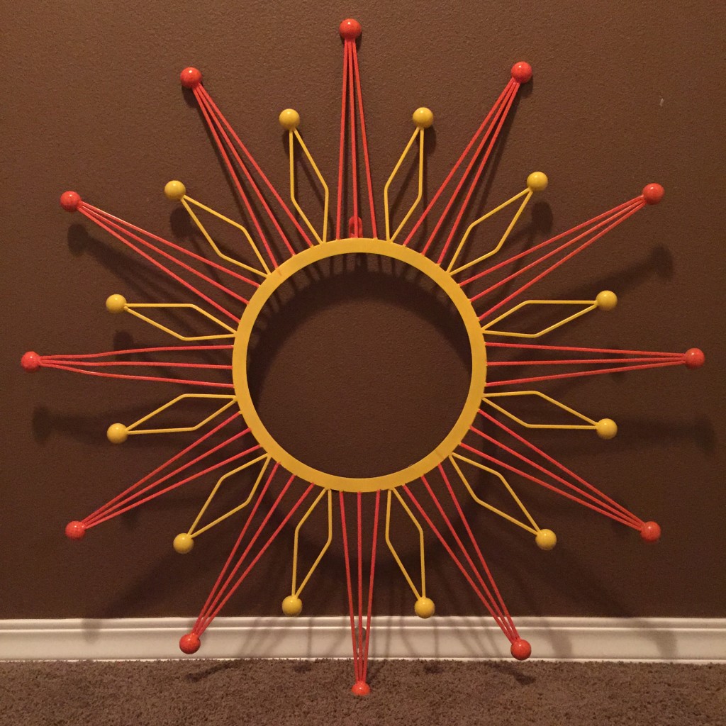 Spray painted metal sun wall decor